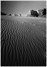 Ripples on sand dunes and mesas, late afternoon. Monument Valley Tribal Park, Navajo Nation, Arizona and Utah, USA (black and white)