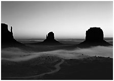 Mittens and fog, sunrise. Monument Valley Tribal Park, Navajo Nation, Arizona and Utah, USA (black and white)
