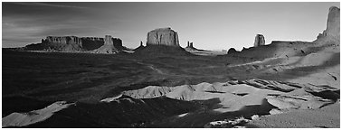 Monument Valley late afternoon scenery with shadows. Monument Valley Tribal Park, Navajo Nation, Arizona and Utah, USA (Panoramic black and white)