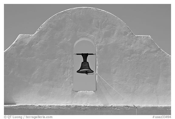Bell and whitewashed wall, San Xavier del Bac Mission. Tucson, Arizona, USA (black and white)