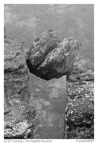 Spherical boulder stuck between pillars. Chiricahua National Monument, Arizona, USA (black and white)