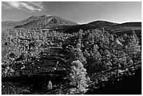 Volcanic hills covered with black lava and cinder, Sunset Crater Volcano National Monument. Arizona, USA ( black and white)