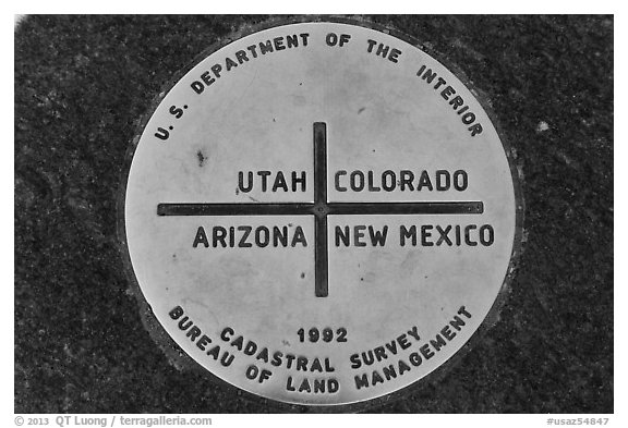 Marker at the exact Four Corners point. Four Corners Monument, Arizona, USA (black and white)