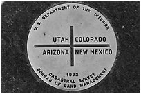 Marker at the exact Four Corners point. Four Corners Monument, Arizona, USA ( black and white)