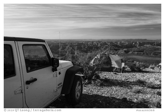 Jeep and tent on Canyon Rim, Twin Point. Grand Canyon-Parashant National Monument, Arizona, USA (black and white)