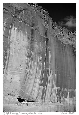 White House Ancestral Pueblan ruins and wall with desert varnish and corner of sky. Canyon de Chelly  National Monument, Arizona, USA (black and white)