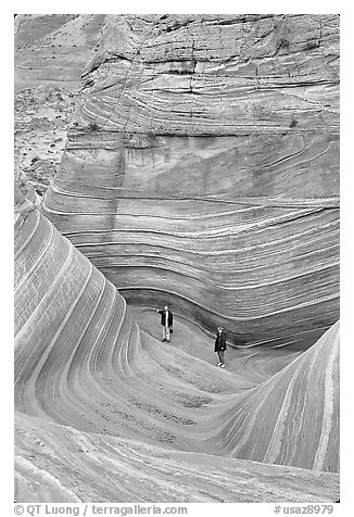Hikers at the bottom of the Wave. Vermilion Cliffs National Monument, Arizona, USA (black and white)