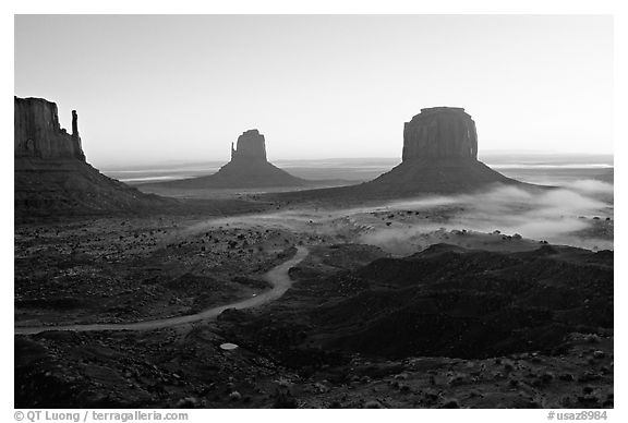 Mittens and fog, sunrise. Monument Valley Tribal Park, Navajo Nation, Arizona and Utah, USA (black and white)