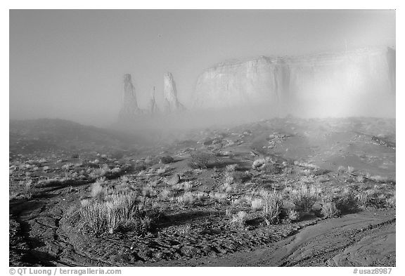 Three sisters, clearing fog, morning. Monument Valley Tribal Park, Navajo Nation, Arizona and Utah, USA (black and white)