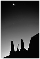 Three sisters and moon, dusk. Monument Valley Tribal Park, Navajo Nation, Arizona and Utah, USA (black and white)