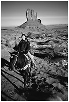 Horseback riding. Monument Valley Tribal Park, Navajo Nation, Arizona and Utah, USA (black and white)