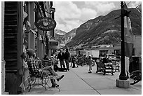 Men sitting on main street sidewalk. Telluride, Colorado, USA ( black and white)