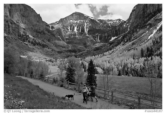 Family hiking on trail towards Bridalveil Falls in the spring. Telluride, Colorado, USA (black and white)