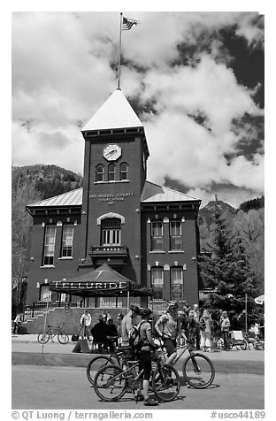 Mountain bikers in front of San Miguel County court house. Telluride, Colorado, USA