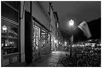 Street with parked bicycles and lamp by night. Telluride, Colorado, USA ( black and white)