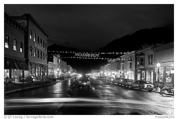 Colorado Street by night with Mountainfilm banner. Telluride, Colorado, USA (black and white)