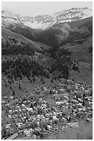 Town, waterfall, and snowy mountains in spring. Telluride, Colorado, USA (black and white)