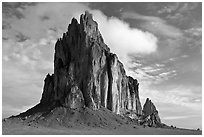 Shiprock with top embraced by cloud. Shiprock, New Mexico, USA (black and white)