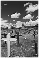 Wooden crosses and old adobe church. Taos, New Mexico, USA (black and white)