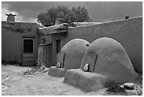Traditional pueblo ovens. Taos, New Mexico, USA ( black and white)