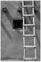 Ladder, Vigas, and blue window. Taos, New Mexico, USA ( black and white)