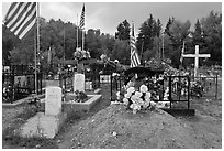 Headstones, tombs and american flags. Taos, New Mexico, USA ( black and white)