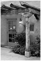 Blue door and window at house entrance. Taos, New Mexico, USA ( black and white)
