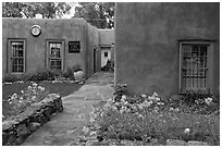Front yard and pueblo style houses. Taos, New Mexico, USA (black and white)