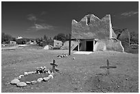 Graves and Picuris Church, Picuris Pueblo. New Mexico, USA ( black and white)
