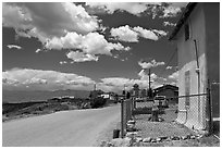 House and main street, Truchas. New Mexico, USA ( black and white)