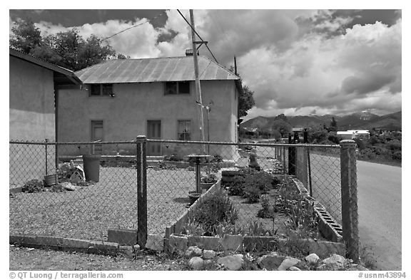 House with blue windows, Truchas. New Mexico, USA (black and white)