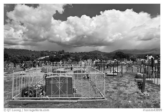 Cemetery and clouds, Truchas. New Mexico, USA