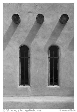 Vigas and deep windows in pueblo style, Sanctuario de Chimayo. New Mexico, USA