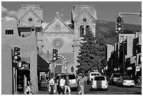 Pedestrians and street with cathedral, downtown. Santa Fe, New Mexico, USA (black and white)