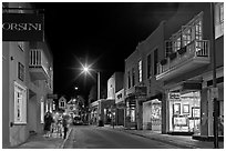 Street with galleries, people walking, and cathedral by night. Santa Fe, New Mexico, USA ( black and white)