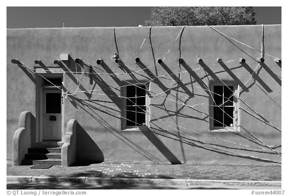 Adobe building tied up with plastic bags. Santa Fe, New Mexico, USA