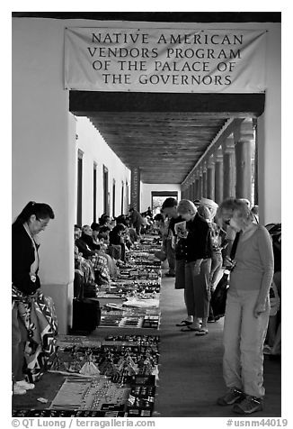Tourists browse wares sold under native american vendors program of the palace of the governors. Santa Fe, New Mexico, USA