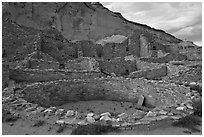 Kiva and multi-storied roomblocks, Pueblo Bonito. Chaco Culture National Historic Park, New Mexico, USA (black and white)