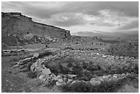 Great Kiva and cliff at sunset, Pueblo Bonito. Chaco Culture National Historic Park, New Mexico, USA ( black and white)