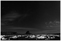 Night landscape with lighted canyon floor. Chaco Culture National Historic Park, New Mexico, USA (black and white)