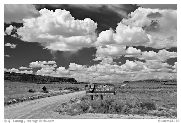Sign and road at the entrance. Chaco Culture National Historic Park, New Mexico, USA (black and white)