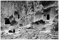 Walls built on Frijoles Canyon floor and dwellings in cavates. Bandelier National Monument, New Mexico, USA ( black and white)