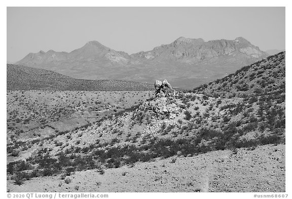 Rock pinnacle and Dona Ana Peak from below Picacho Mountain. Organ Mountains Desert Peaks National Monument, New Mexico, USA (black and white)