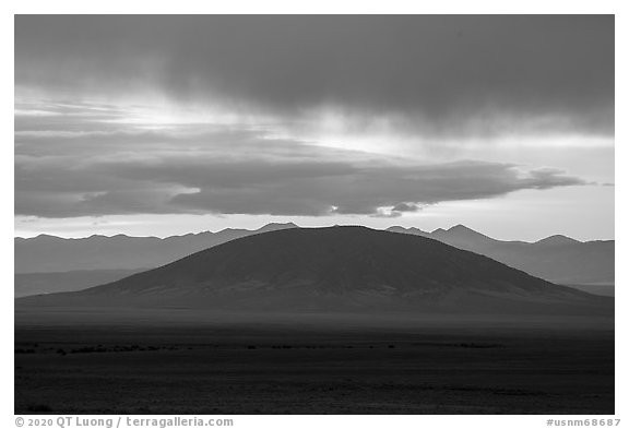 Ute Mountain with rain clouds at sunrise. Rio Grande Del Norte National Monument, New Mexico, USA (black and white)