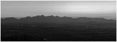 Las Cruces and Organ Mountains at sunrise. Organ Mountains Desert Peaks National Monument, New Mexico, USA (Panoramic black and white)