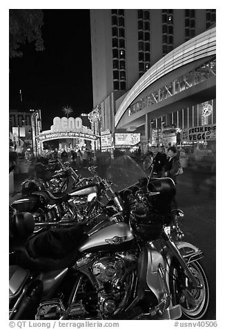 Harley-Davidson motorcycles on downtown street at night. Reno, Nevada, USA