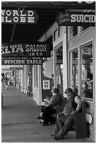 Arcade with suicide table sign. Virginia City, Nevada, USA (black and white)