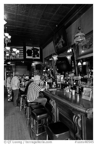 Men inside historic saloon. Virginia City, Nevada, USA (black and white)