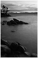 Sunset over lake with boulders, Sand Harbor, East Shore, Lake Tahoe, Nevada. USA ( black and white)