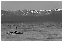 Kayak, turquoise waters and snowy mountains, East Shore, Lake Tahoe, Nevada. USA ( black and white)